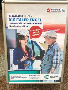 Ein Foto von einem Aufsteller mit Werbung für den Besuch des Digitalen Engel in Norderstedt.